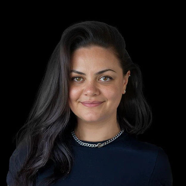 Headshot of Savic Motorcycles CGO Victoria Brown against a black background